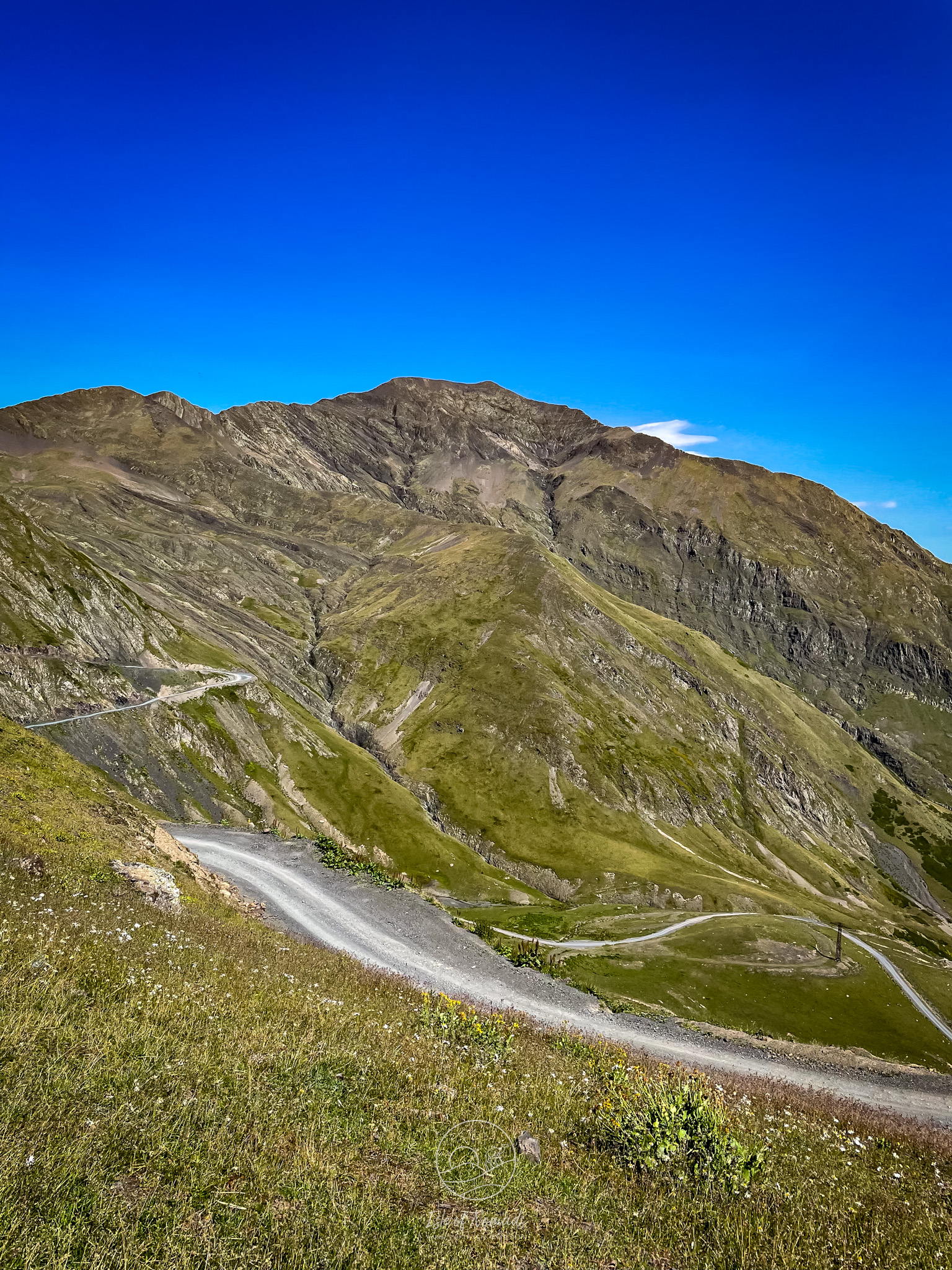 The road leading down from the Abano pass on the northern side